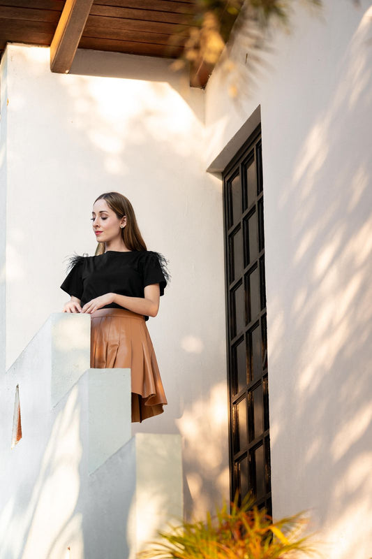 Falda de vinipiel plizada