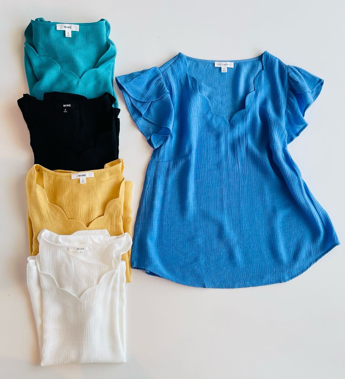 Blusa de manga corta varios colores con detalle en la manga Tb8485